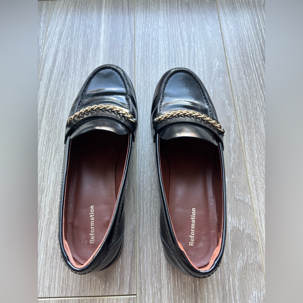 Reformation Glossy Black Loafers with Gold Accent